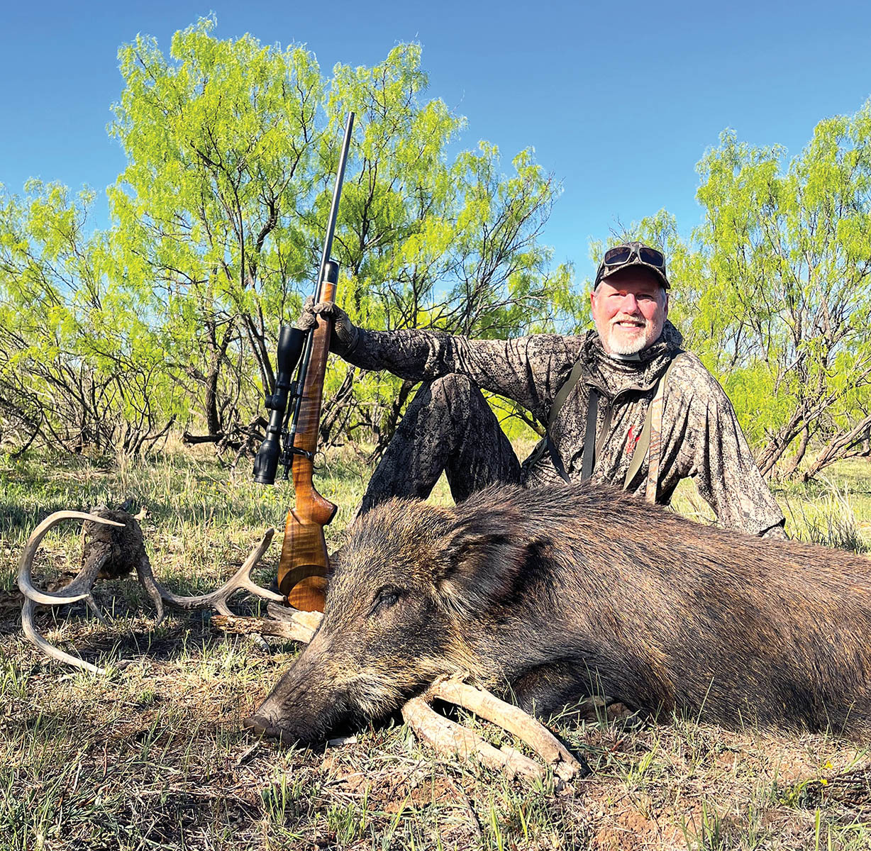 Patrick didn’t need a high-BC bullet to take this trotting hog at 300 yards, but  the high  sectional density of Berger’s 140-grain VLD Hunting  sent this hefty hog tumbling  with a  single shot.